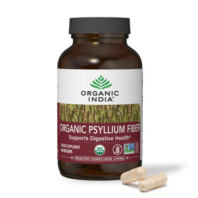 Capsules de psyllium bio ORGANIC INDIA dans un verre d'eau