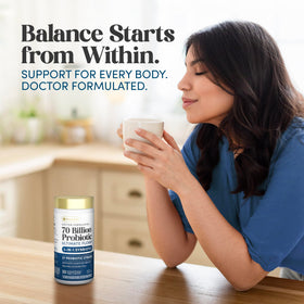 Capsules de Renew Life Probiotique Ultimate Flora sur une table en bois