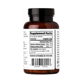 Capsules de Santa Cruz Paleo Magnésium + Potassium sur une surface blanche