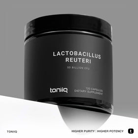 Capsules de Toniiq Probiotique Lactobacillus Reuteri sur une surface blanche