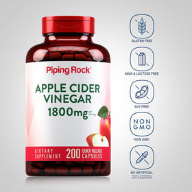 Capsules de vinaigre de cidre de pomme Piping Rock prises dans une main
