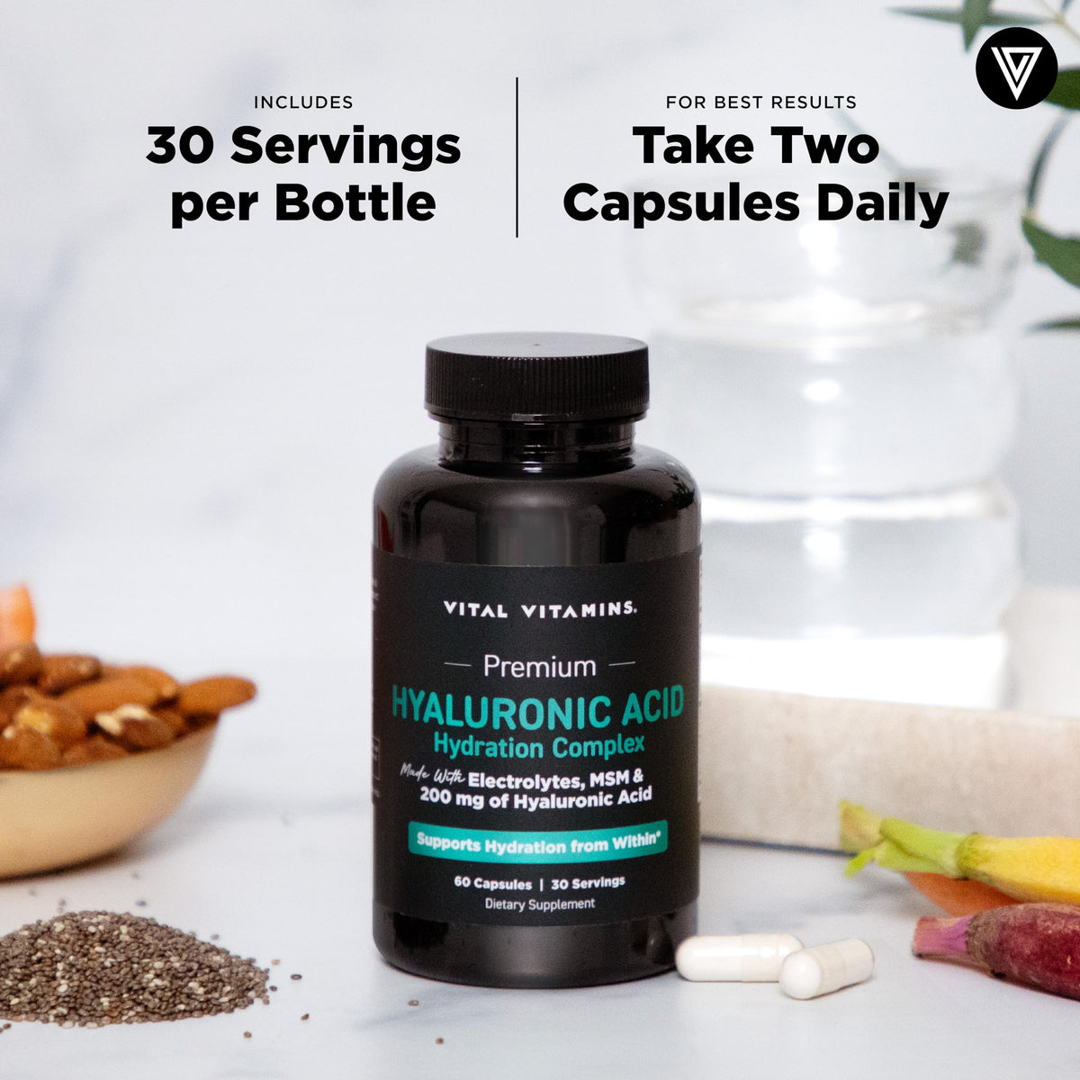 Capsules de Vital Vitamins dans un verre d'eau