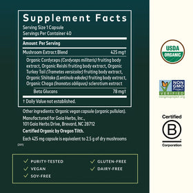 Capsules Gaia Herbs Champignons Quotidiens sur une surface en bois