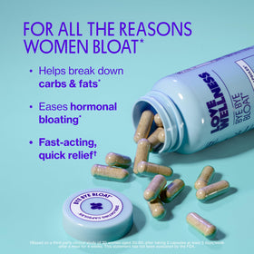 Capsules Love Wellness en gros plan sur une surface blanche
