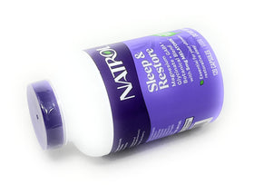 Capsules Natrol Sommeil & Récupération sur une surface en bois