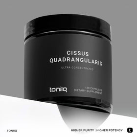 Capsules Toniiq Cissus Quadrangularis sur une table en bois