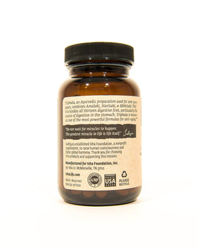 Capsules Triphala Bio ISHA dans un bol en bois