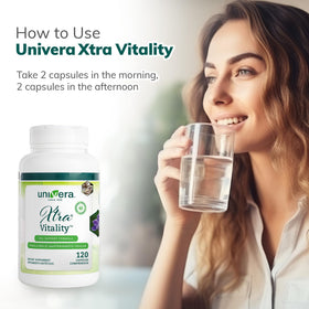 Capsules Univera Xtra Vitality sur un fond neutre