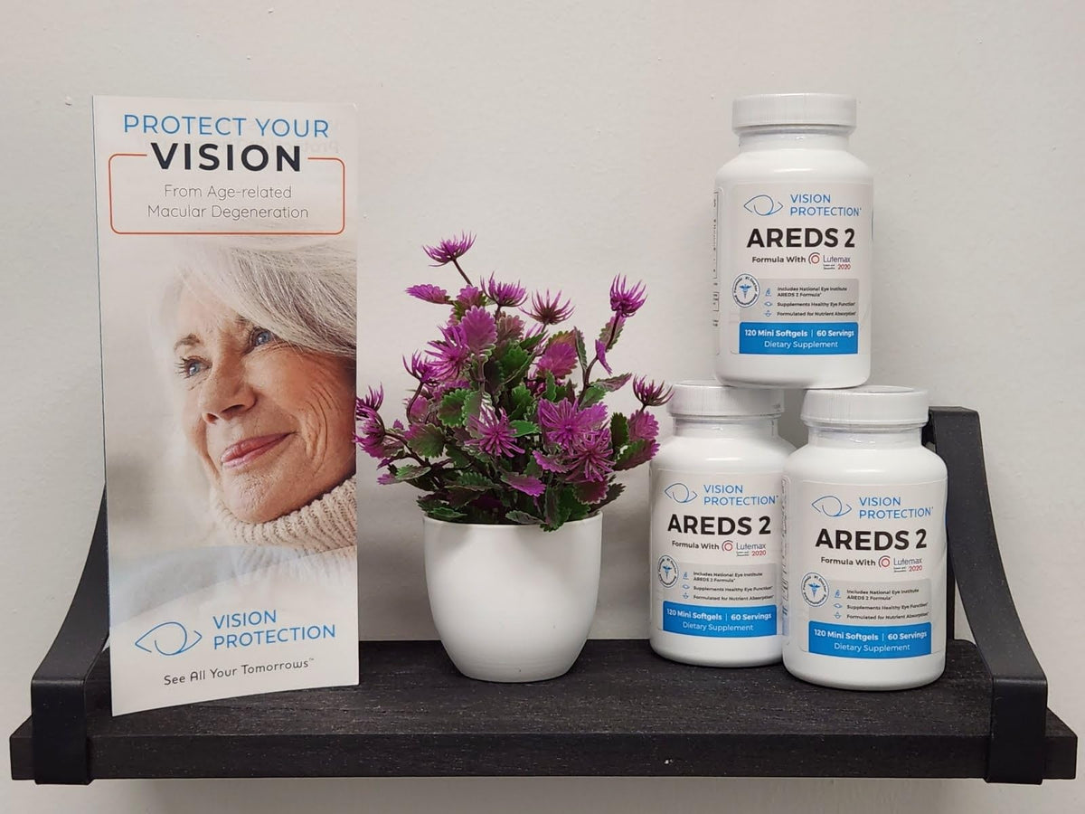 Capsules VISION PROTECTION AREDS 2 à côté d'un verre d'eau