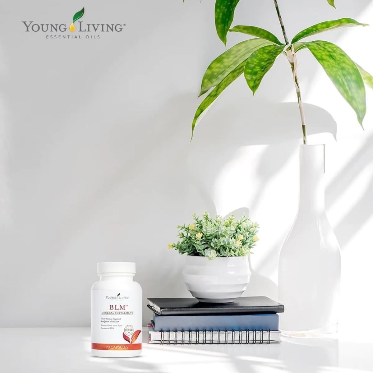 Capsules Young Living BLM avec un verre d'eau