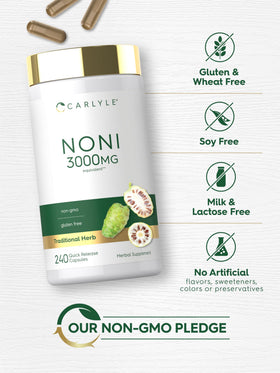 Carlyle Capsules de Noni à côté d'un verre d'eau