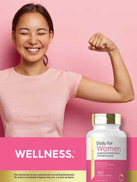 Carlyle Multivitamines pour Femmes, mise en scène sur une table avec des fruits