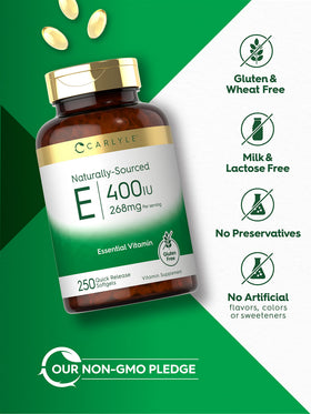Carlyle Vitamine E 400 IU capsules sur une surface en bois
