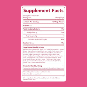Clean Simple Eats Super Greens Poudre Framboise Citronnade 390g en préparation dans un verre