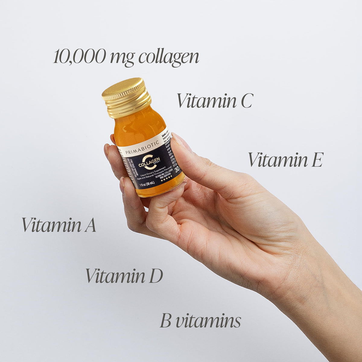 Collagène liquide PRIMABIOTIC sur une table avec fruits