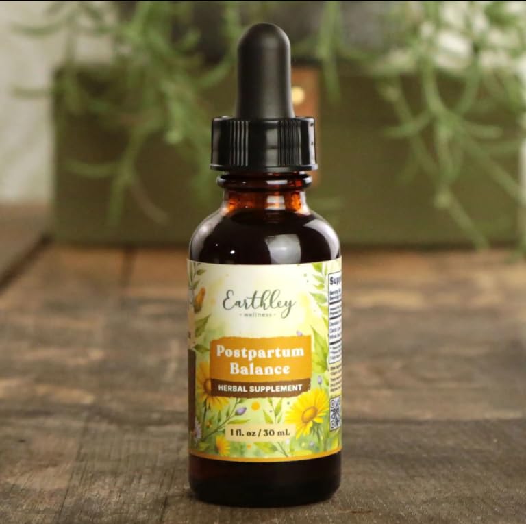 Complément alimentaire Earthley Wellness Postpartum Balance 136g avec une cuillère