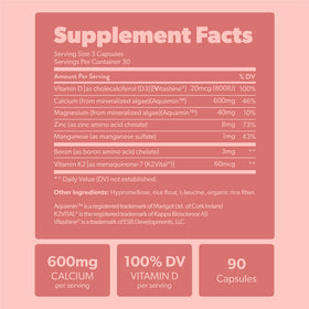 Complément de calcium sapling 600mg avec une plante en arrière-plan