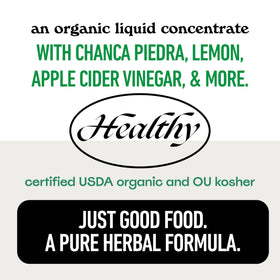 Complément Liquide Rénal 16oz avec verre et citron frais à côté