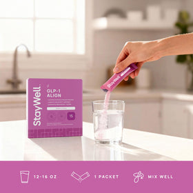 Complément Stay-Well Naturals sur une table avec des fruits
