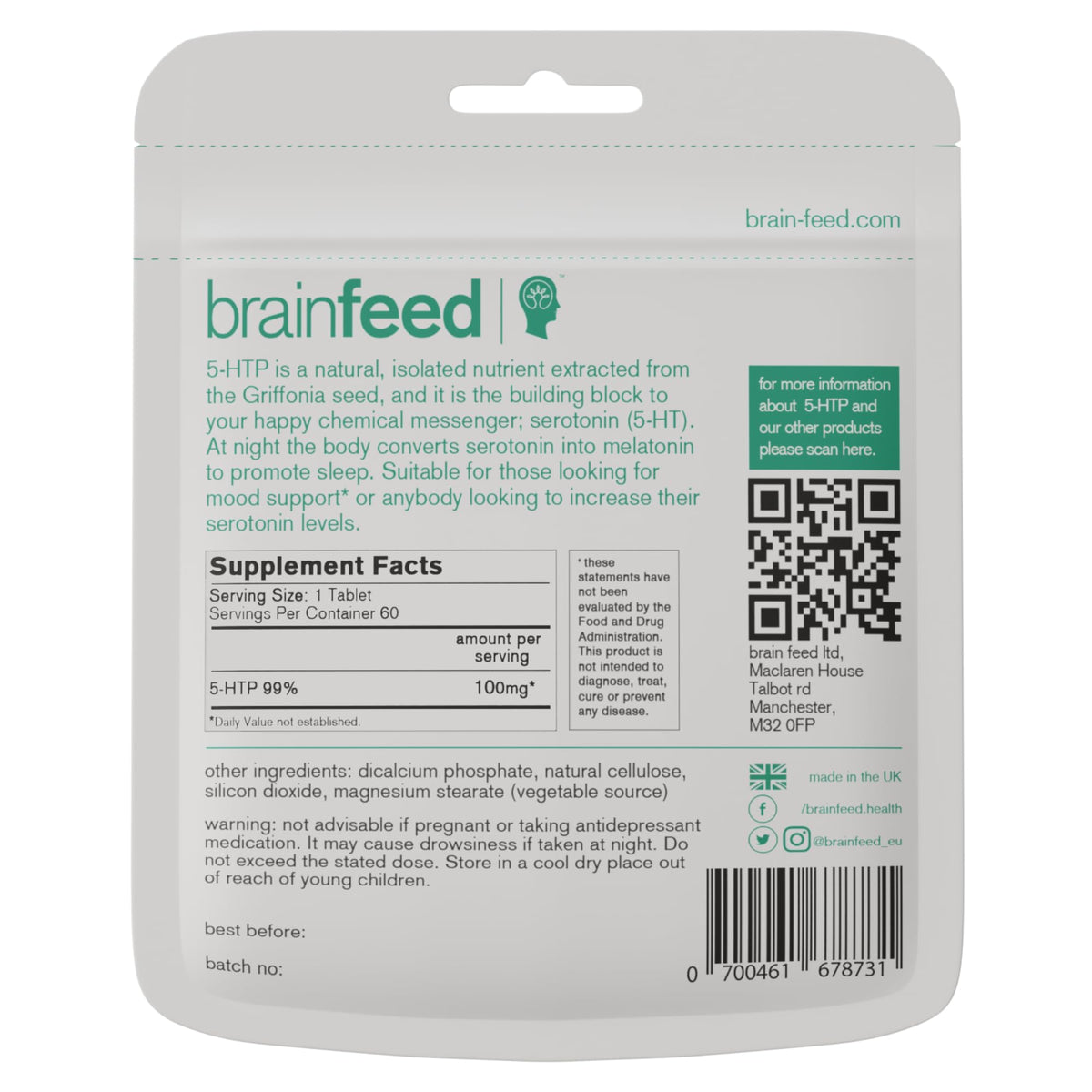 Comprimés 5-HTP brain feed à côté d'une tasse d'eau