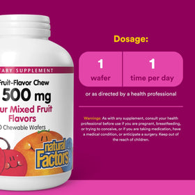 Comprimés à mâcher Natural Factors Vitamine C sur une surface en bois