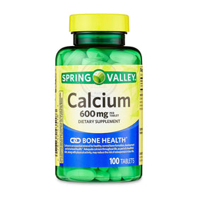 Comprimés de calcium STS Home sur une surface blanche
