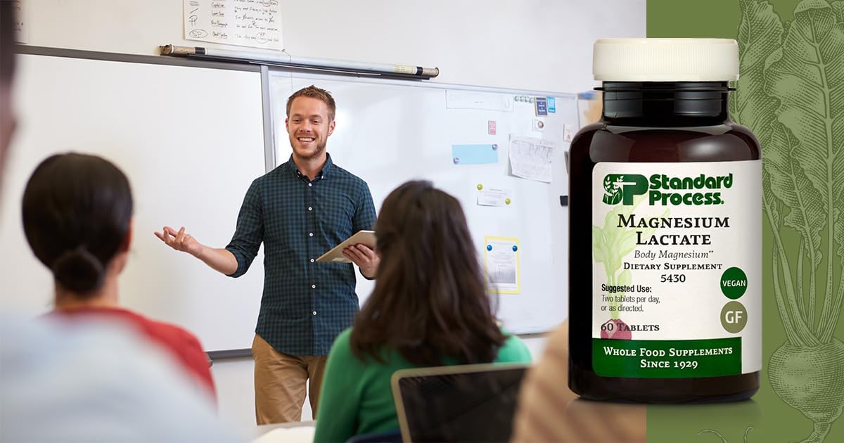 Comprimés de Lactate de Magnésium Standard Process sur une surface blanche