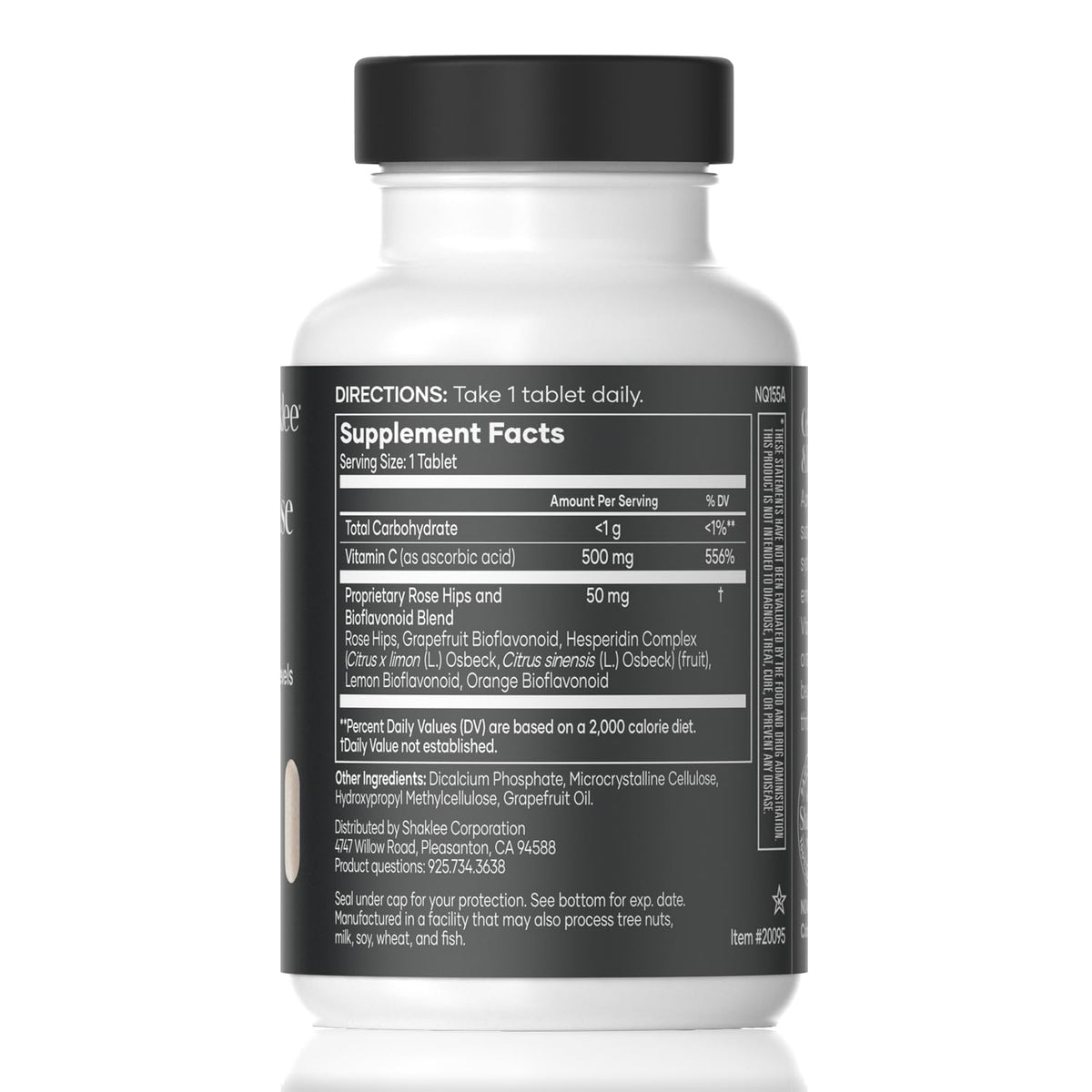 Comprimés de Shaklee Vita-C® 500 mg sur une surface blanche