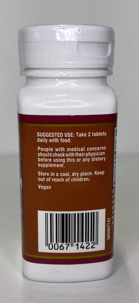 Comprimés de TJ's Calcium Magnésium Zinc sur une surface en bois