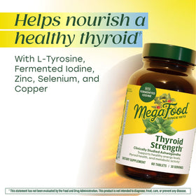 Comprimés MegaFood Thyroid Strength sur une surface en bois