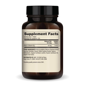 Comprimés mini de Niacine Vitamine B3 Dr. Mercola sur un fond blanc