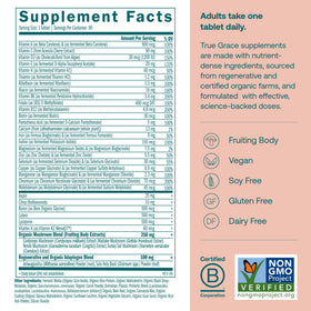 Comprimés végétaliens True Grace Multivitamines Femme sur une surface en bois