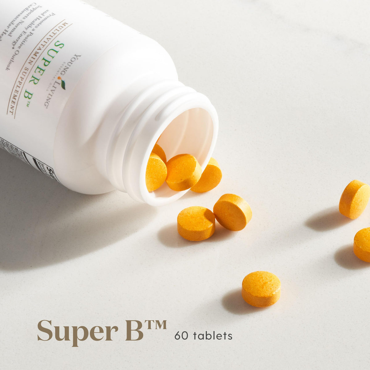 Comprimés Young Living Super B sur une surface blanche