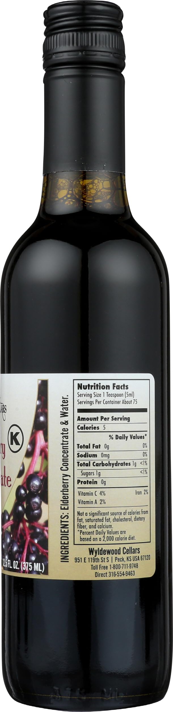Concentré de jus de sureau Wyldewood Cellars avec verre à côté