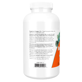 Cuillère de poudre de farine d'os NOW Foods sur une table