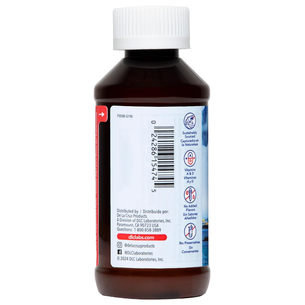 De La Cruz Huile de Foie de Morue Pure 4 oz à côté d'une assiette