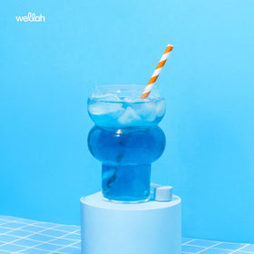 Détail de la poudre de créatine Wellah dans une cuillère