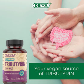 DEVA Vegan Tributyrin 500 MG capsules with background of fresh vegetables