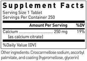 Douglas Laboratories Calcium Citrate comprimé sur une surface blanche