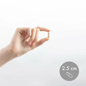 Dr. Mercola Calcium avec capsules ouvertes sur une table