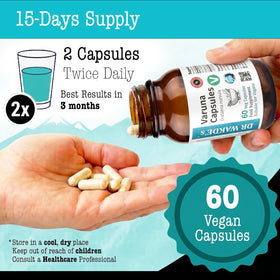 DR WAKDE's Varuna Capsules sur une table avec un verre d'eau chaude