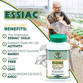 Essiac Gold® avec AHCC® capsules à côté d'un verre d'eau