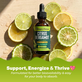 Extrait de bergamote Drops Of Nature avec un verre d'eau