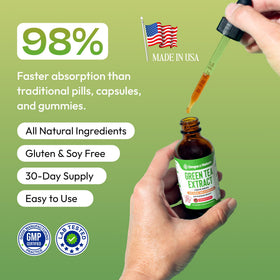 Extrait de thé vert Drops Of Nature 60 mL sur une table avec des fruits
