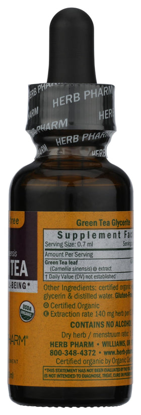 Flacon d'extrait de thé vert Herb Pharm ouvert avec un verre d'eau