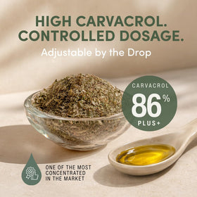 Flacon d'huile d'origan AROMAVITA sur une table en bois
