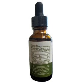 Flacon d'huile de chanvre bio Restorative Botanicals sur une table en bois