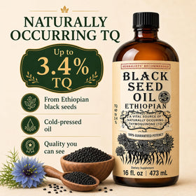 Flacon d'huile de nigelle éthiopienne avec graines de nigelle en arrière-plan