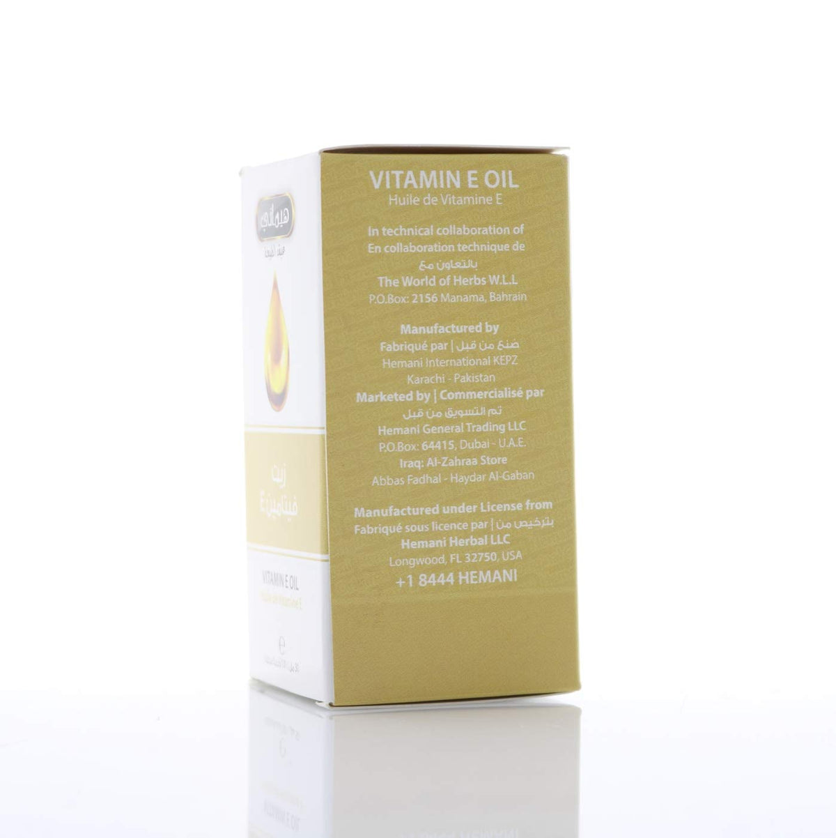 Flacon d'huile de vitamine E Hemani 30ml sur un fond de marbre