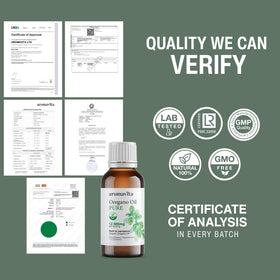 Flacon d'huile essentielle d'origan AROMAVITA sur une table en bois
